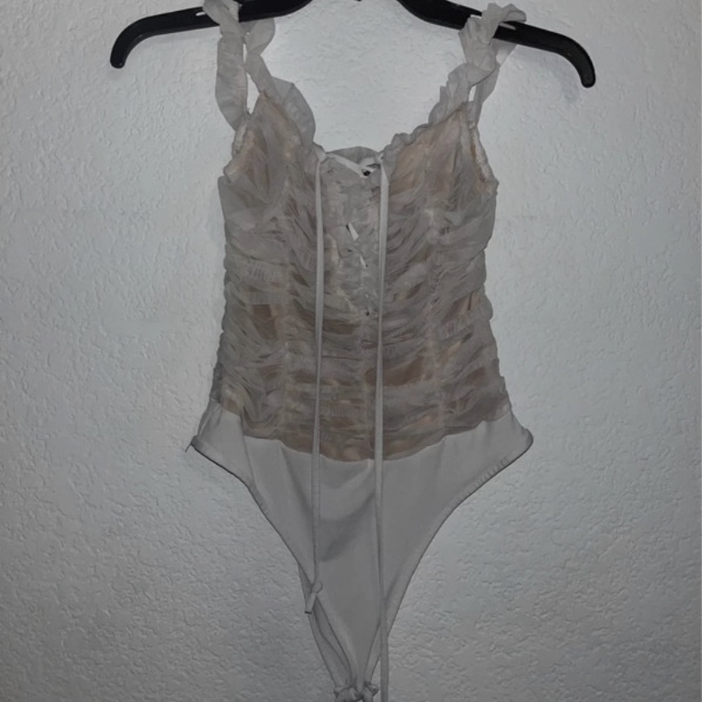 white ruffle bodysuit